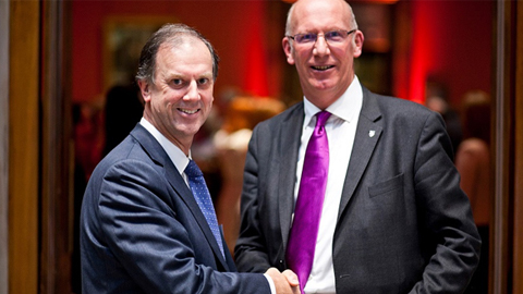 Chris Gill shaking hands with Professor Robert Allison